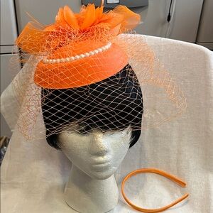 Elegant Orange Fascinator with Pearl Accents on Cap, Veil, Flowers and Feathers